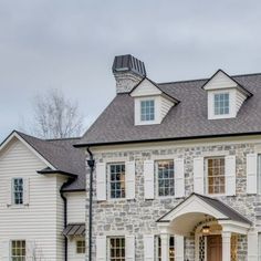 a large white house with two story windows