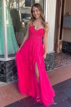 Expertly crafted with a sweetheart neckline and strapless design, this A-line prom dress showcases intricate appliques on soft tulle. Experience the perfect combination of style and grace in this stunning dress.