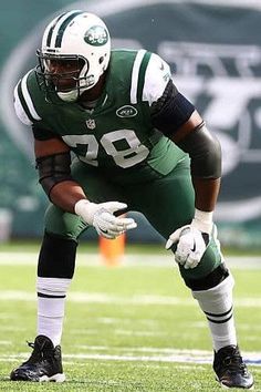 a football player kneeling down on the field