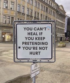 a sign that says you can't heal if you keep pretending you're not hurt