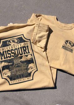 Show off your team pride in this Missouri Tigers Gold Comfort Colors Short Sleeve T Shirt! This Mizzou Tigers Short Sleeve Tee features a screenprint of university landscape graphic on back. Make sure everyone knows you root for the Tigers with this Gold Mizzou Tigers T Shirt. Mizzou Rah! Comfort Colors brand, 100% ring spun cotton, Soft hand, washed garment dyed fabric, Double needle collar, armhole, sleeve and bottom hems, Twill taped neck and shoulders, Twill joker label, Unisex fit, Screen p Mizzou Shirts, University Landscape, Landscape Graphic, Christmas Lists, Mizzou Tigers, Missouri Tigers, Tiger T Shirt, Color Shorts, Short Sleeve T Shirt