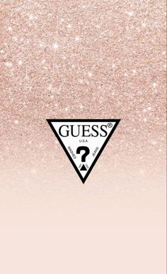 the guess logo on a pink and gold glittered background with question mark in black