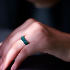 a woman's hand with a ring on it