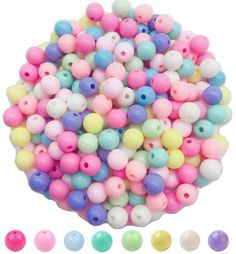 several colors of plastic beads are arranged in a circle