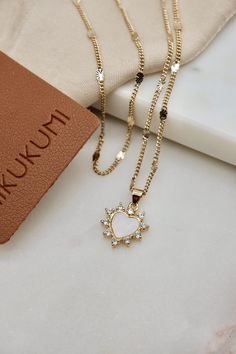 Details: - 18K Gold Filled Curb chain - Pendant size:  21.7mm x 15.4mm - Pendant material: 18K Gold Plated with Cubic Zirconia Stone Set A: 15.5 inches Curb Chain 17.5 inches Heart Curb Chain Necklace Set B: 17.5 inches Curb Chain 19.5 inches Heart Curb Chain Necklace Each item is individually placed on our MIKUKUMI leather card & cotton pouch. Heart Shaped Jewelry With Heart Charm For Birthday, Heart Charm Jewelry For Birthday Gift, Heart-shaped Jewelry With Heart Charm For Birthday, White Gold Plated Heart Necklace For Anniversary, White Heart Pendant Necklace For Birthday Gift, White Heart Pendant Jewelry For Birthday Gift, Gold Double Heart Jewelry For Birthday Gift, Gold Double Heart Necklace For Birthday, Gold Cubic Zirconia Heart Necklace For Anniversary