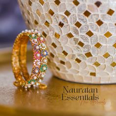 Explore the flamboyance of nauratan essentials! A magnificent composition of nauratan stones along with pearl moti detailing striking immense beauty - perfect to make a style statement. Kindly note that these bangles are openable for easy wearing. Gold-plated on high-quality brass as base metal. Made by order. Kindly note that the delivery time frame for Size 2.4, 2.6 & 2.8 is 4-6 weeks and for Size 2.2 it is 5-7 weeks. For custom or urgent requests, please contact support@alacouture.com. *Pleas Unique Gift Cards, Create Words, Faux Stone, A Style, Style Statement, Base Metal, Free Giveaway, Bead Work, Beautiful Jewelry