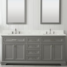 two mirrors are above the double sinks in this bathroom with gray cabinets and marble countertops