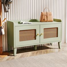 a handbag and purse are sitting on a green cabinet