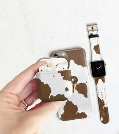 Build your own tech accessories set. Brown cow print in a soft matte finish on an iPhone case, Airpods case and/or Apple Watch band.  The brown and white animal print is bonded directly into the plastic of the slender cases and UV printed on the vegan leather band. Due to the different materials and ink batches, final print colors may not be a perfect match between items. Thoughtful gift for the modern western aesthetic. Made just for you, allow 3-8 business days before your new cases and Apple Cow Print Accessories, Cow Print Things, Brown Cow Print, Cowgirl Gifts, Apple Watch Sizes, Brown Cow, Cow Gifts, Modern Western