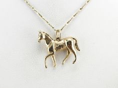 A horse is caught galloping in this sweet vintage charm! The size of this gold piece allows it to be worn on a charm bracelet but is also large enough to wear on a pendant chain. Sweetly designed with a sense of motion and life, this will be a wonderful gift for any equestrian lady. This pendant does not come with the chain shown. Please feel free to contact us, we will help you find the perfect chain for your style and budget! Metal: 14K Yellow Gold Measures: 22 x 22 mm Marks: "14K" Stamped on Vintage Horse, Gold Piece, A Horse, Eternity Bands, Vintage Charms, Equestrian, Arrow Necklace, Silver Necklace, Motion