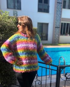 Chunky Colourful Rainbow Striped Oversized Sweater - the reigning champion and best seller of the year! 🏆✨ Crafted with love from premium acrylic, this beauty is made using vegan yarn, ensuring both style and ethics! 🌿💖 Prepare yourself for the ultimate cuddle experience - it's not just soft and cozy, it's downright cuddle-worthy, and guess what? No itchiness! 🚫🤗 This oversized wonder the model wearing is a size Large, most customers believe bigger is better for that perfect chunky look! 😍 Multicolor Chunky Knit Casual Sweater, Colorful Knitted Crew Neck Sweater, Oversized Rainbow Casual Sweater, Casual Multicolor Chunky Knit Sweater, Casual Oversized Rainbow Sweater, Casual Multicolor Knitting Pattern For Winter, Casual Long Sleeve Hand Knitted Pattern, Oversized Rainbow Sweater For Fall, Casual Multicolor Knitting Pattern For Fall