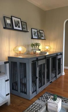 a living room filled with furniture and pictures on the wall