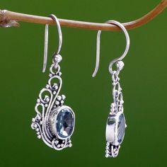 Showcase your inner beauty like a peacock's brilliant plumage. Silver tendrils extend upwards in a showy display. Bali artisan Sukartini crafts these feminine dangle earrings from sterling silver, adding 2 carats of sparkling blue topaz. Sterling silver & blue topaz Hook earrings Combination finish Handmade in & fairly traded from Indonesia Paw Print Jewelry, Blue Peacock, Ribbon Jewelry, Blue Topaz Earrings, Printed Jewelry, Topaz Earrings, Peacock Blue, Earrings Blue, Peacock Feather