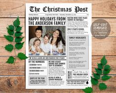 the christmas post newspaper is laying on a wooden table next to some green leaves and ivy