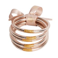 Fabulously festive and glamorous BuDhaGirl Champagne All Weather Bangles® (AWB®), are the epitome of luxury in BuDhaGirl's impressive lifestyle collection. Our remarkable bangles redefine elegance with their weightless, soundless, waterproof, and TSA-proof design. Crafted to perfection, each set comprises six bangles, symbolizing intentions for the day. Wear them anywhere, as their soundless and waterproof nature ensures seamless integration into any setting. Begin your morning by slipping each Bangle Box, Serenity Prayer, Spray Tanning, Gold Bangle Bracelet, Bangle Set, Gold Bangles, Gold Leaf, Bracelet Set, Modern Woman