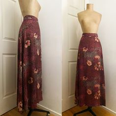 "1970s HOBNOBBER floral A Line long skirt. Poppy / Dogwood floral print on stipled black ground, shades of pink, wine, mauve and brown. Waistband with front & back darts, center back button & nylon YKK zipper. Size 0, 2, 4 / 27.5 Inch Waist 100% Rayon, very soft, drape-y hand Excellent Condition: I did a reinforcement repair behind button on waistband, I see a couple shifted threads MEASURMENTS * Waist: 27.5\" / 70cm * Hips: 38\" * Sweep from side seam to side seam: 36.5\" / 93cm * Lengt A Line Long Skirt, Black Ground, Pink Wine, Floral Maxi Skirt, Langer Rock, Long A, Ykk Zipper, Beautiful Skirts, Floral Maxi