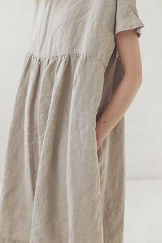 "DETAILS * Oversize linen summer dress * With two side pockets * Loose fit suitable for casual wear * For all body types * Made from soft wash medium weight (185 g) 100 % European linen fabric * Height of the model is 177 cm (5′ 8″) and she is wearing dress in size XS/S and flax linen color. Full dress length laying down on the floor is +/- 101 cm (39.8\"), the sleeve length is +/- 17 cm (6.7\"). * Please choose another color and size on the right * Product number: D42 CARE LABEL * machine wash Spring Beige Linen Dress With Pockets, Spring Flax Linen Dress With Pockets, Casual Flax Color Relaxed Fit Dress, Linen Sundress With Pockets For Spring, Summer Linen Dress With Side Pockets, Neutral Spring Dresses With Pockets, Summer Knee-length Sundress With Pockets, Casual Beige Dresses With Slip Pockets, Casual Beige Dress With Slip Pockets