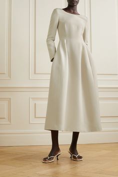 The Row's 'Lilibet' dress is the very definition of minimal elegance. Made in Italy from wool and silk-blend crepe, it has a chic boat neckline and nipped-in waist emphasized by darted pleats. Style yours with a tonal clutch and low-heeled mules. Elegant Structured Dinner Dresses, Formal White Silk Crepe Dress, White Silk Crepe Formal Dress, Elegant Structured Wedding Dresses, Elegant White Silk Crepe Dress, Elegant Midi Dress With Structured Shoulders For Wedding, Elegant Wedding Midi Dress With Structured Shoulders, Elegant Silk Crepe Wedding Dress, Classic Cream Evening Midi Dress