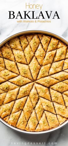 honey bakalava with walnuts and pistachios in a round pan