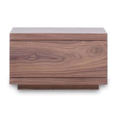 a wooden box sitting on top of a white surface