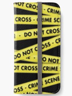 yellow and black caution tapes with the words do not cross on them iphone wallet case