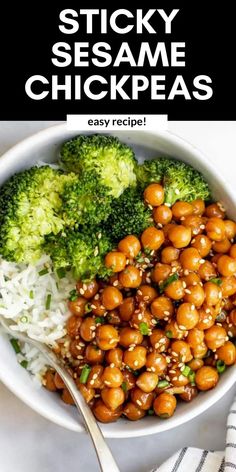 a bowl filled with chickpeas and broccoli on top of a table