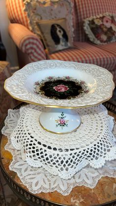 two plates stacked on top of each other in front of a red and white couch