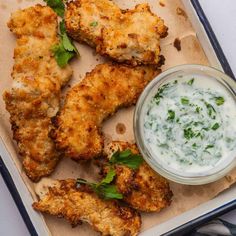 chicken wings with ranch dressing on a tray