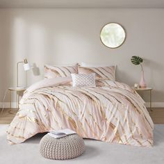 a bed room with a neatly made bed and a round mirror on the wall above it