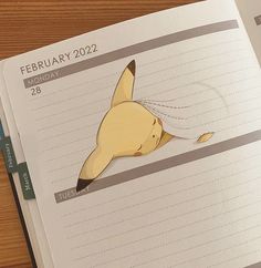 an open planner with a drawing of a banana on it and the date is feb 22