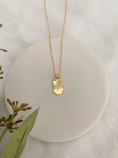 SOL NECKLACE This 14K Gold Filled Sun necklace is the perfect piece for lovers of the sun and summer! The sun tag has a vintage look. Gold filled is hypoallergenic, and water & tarnish resistant. △ 21x10mm Gold Filled sun tag pendant △ 14K Gold Filled Chain △ Dainty 14K Gold Filled lobster clasp closure △ Choose your length Gold Filled La Luna (Moon) Necklace available here! See more Minimal Charm Necklaces here!: https://etsy.me/3sqYLeQ Photos of dainty jewelry are taken close up to show de 14k Gold Necklaces With Sun Design, 14k Gold Sun Design Necklaces, 14k Gold Sun Design Necklace, Gold Sun-shaped Jewelry For Everyday, Everyday Yellow Gold Sun And Moon Necklace, Dainty Gold Sun-shaped Necklace, Gold Sun-shaped Necklace As A Gift, Gold Sun-shaped Necklace Gift, Gold Sun-shaped Necklace For Gift