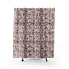 a shower curtain with pink flowers and leaves on the bottom, in front of a white background