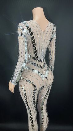 Elevate your stage presence with our exquisite Handmade Sparkly Rhinestones Sequins Jumpsuit! This captivating garment is the perfect choice for women looking to make a glamorous statement at any special occasion. from celebrating birthdays to lighting up the dance floor.Crafted with a blend of high-quality Polyester and Spandex. this jumpsuit ensures both comfort and flexibility. allowing you to move with grace and confidence. Its intricate design is an ode to Folk Dance. showcasing the fusion Glamorous Evening Bodysuit, Elegant Party Bodysuit For Party Season, Gold Stretch Jumpsuits And Rompers For Party, Glamorous Embellished Bodysuit For Evening, Glamorous Embellished Evening Bodysuit, Glamorous Bodysuit For Evening Party Season, Glamorous Fitted Bodysuit With Rhinestones, Elegant Club Bodysuit With Rhinestones, Elegant Bodysuit With Rhinestones For Club