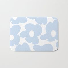 a blue and white flower pattern bath mat