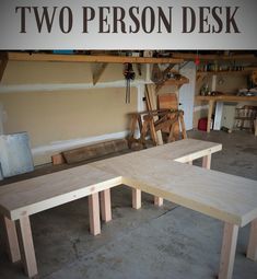 two wooden benches sitting next to each other in a room with workbench and tools