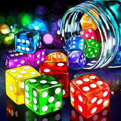 colorful dices are sitting in front of a glass jar with lights on it and one is