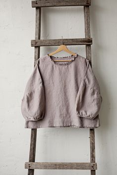 Tunic is made from 100% soft and washed linen. Match it with our skirts! Details: - Composition: 100% Oeko-Tex certified linen - Colour: lavender - Ruffle neckline - Dropped shoulders - Size: One size/fits all - Medium weight linen - Linen care: machine wash gentle; tumble dry low, ironing optional - The price is for one tunic, other pictured items are not included Measurements: Length from shoulder down: 55 cm (21,66 in) Chest width: 140 cm (55,1 in) Sleeve length (from collar): 60 cm (23,6 in) Linen Lagenlook Tops For Daywear, Flax Long Sleeve Relaxed Fit Blouse, Flax Colored Long Sleeve Relaxed Fit Blouse, Relaxed Fit Long Sleeve Blouse In Flax Color, Relaxed Fit Long Sleeve Flax Blouse, Relaxed Fit Ramie Blouse For Daywear, Oversized Long Sleeve Ramie Tops, Linen Lagenlook Tunic Top, Linen Tunic Top In Lagenlook Style