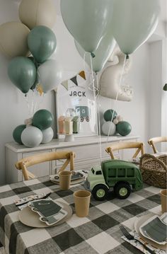 Pastel garbage truck-themed birthday setup with mini garbage can loot bags, custom cake toppers, and balloon bouquets. Truck Theme 1st Birthday Party, Trash Truck Balloon Garland, Third Gear Birthday, 2nd Boys Birthday Party Ideas, School Theme Birthday Party, Second Bday Party Ideas Boy, Birthday 2 Year Boy, Simple Boy Birthday Decorations