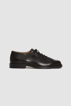 A black smooth leather oxford with criss-crossed detailing a waxed lace-up front fastening a round toe with tonal stitch detailing and a chunky leather sole. the edouard is a minimalist urban shoe inspired by vagabond lifestyle. with its thick padded sole it is both comfortable and long wearing. jacques solovière paris's lace-up oxfords are handcrafted in their historic factory. Vagabond Lifestyle, Urban Shoes, Mens Designer Shoes, Denim Hat, Soft Bra, Jute Bags, Mens Oxfords, Engineered Garments, Summer Accessories