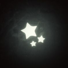 the silhouette of three stars is shown in the dark