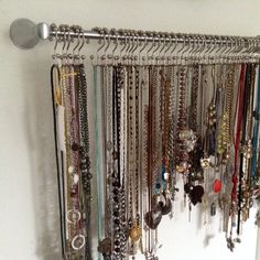 a bunch of bracelets hanging on a wall