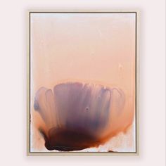 an abstract painting with white and brown colors in a square frame on a pink wall