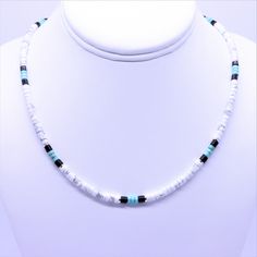 "This Native American inspired beaded heishi necklace is made with natural white buffalo turquoise from Nevada, blue green turquoise, black onyx, and sterling silver spacer beads. The beads are uniform in size, making for a clean flowing pattern of semi precious gemstones. The AAA grade white buffalo turquoise beads are beautiful shades of gray and white polished to a fine quality semi gloss luster that compliments that of the green turquoise and black onyx. White Buffalo Turquoise This rare whi Southwestern Style White Beaded Necklace As Gift, White Heishi Beads Hand-strung Necklaces, White Heishi Beads Necklaces Hand-strung, White Hand-strung Heishi Bead Necklaces, Hand-strung White Heishi Bead Necklaces, White Heishi Beads Single Strand Jewelry, Southwestern White Beads For Gift, Southwestern Style White Beads For Gift, Southwestern Style White Beads As Gift