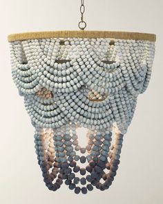 a chandelier made out of beads hanging from a ceiling