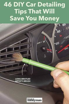 a hand holding a green brush in front of a car dashboard with the words, 46 diy car detailing tips that will save you money