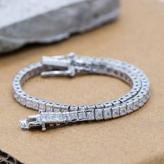 Sparkling Cubic Zircon Bracelet, 925 Sterling Silver Bracelet, Zirconia Silver Bracelet, Tennis Silver Bracelet, New Year Gift's  ✦ ✦  METAL DETAILS✦ ✦ ✦ Metal : 925 Sterling Silver ✦ Bracelet Total Weight : 9.34 Gram  ✦ Bracelet Size : 7.5 Inch  ✦ ✦ CUSTOMISATION DETAILS✦ ✦  We can customize any piece of fine jewelry. You can simply message us on Etsy or drop a text at +91-7357229656 (WhatsApp/I Message) to let us know about all the customization you want. Customization can include : ✦ The Gemstone: This Bracelet  can be made in Emerald, Ethiopian Opal, Rainbow Moonstone, Sapphires, Citrine, Ruby, Tanzanite, Diamond, Kyanite, Garnet, Tourmaline, and any gemstone you would like! ✦ Size and Shape: We can totally change the size of the gemstone (Bigger/Middle/Smaller) and shape too (Emerald Silver Sterling Silver Tennis Bracelet Gift, Silver Sterling Tennis Bracelet As Gift, Silver Fine Jewelry Tennis Bracelet Gift, Silver Tennis Bracelet As Gift, Fine Jewelry Style, Silver Sterling Tennis Bracelet For Gift, Cubic Zirconia Sterling Silver Bangle Bracelet Gift, Silver Cubic Zirconia Bracelet As Gift, Silver Jubilee Tennis Bracelet As Gift, Zircon Bracelet