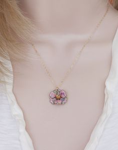 "Description This sweet little pendant necklace features a rare vintage enamel pink confetti pansy flower trimmed with a gold finish. . Great gift for the flower lover in your life or treat yourself to a lovely pansy pendant Hangs from a fine 14 karat gold filled chain. The Pansy is 1 \" wide, vintage elements are in excellent condition. ** The last photo shows a different pansy with the soaring bird charm, this pansy is the same size as the pink one Spring closure clasp Photoed with a 16\" chai Enamel Flower Pendant Necklace With Flower Charm, Enamel Flower Pendant Necklace With Charm, Enamel Necklaces With Flower Charm And Pendant, Flower Charm Enamel Necklace, Floral Enamel Necklace With Flower Charm, Enamel Flower Charm Necklace, Enamel Pendant Jewelry With Flower Charm, Charming Pink Pendant Jewelry, Pink Enamel Flower-shaped Jewelry