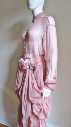 For Sale on 1stDibs - A gorgeous set from Dolce & Gabbana consisting of a shirt and skirt made of pale pink sheer silk . The long sleeve shirt style top has a small collar and Chic Pink Blouse With Sheer Sleeves, Fitted Long Sleeve Silk Chiffon Blouse, Feminine Long Sleeve Silk Chiffon Dress, Elegant Pink Blouse With Sheer Sleeves, Pink Long Sleeve Blouse With Sheer Sleeves, Spring Silk Chiffon Fitted Blouse, Spring Fitted Silk Chiffon Blouse, Feminine Silk Chiffon Blouse For Spring, Spring Silk Blouse For Cocktail