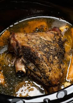 a close up of a meat in a slow cooker