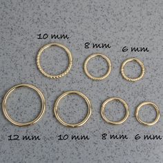 This Plain/Twisted hoop earring is entirely handmade. All components are crafted using 14-karat gold. White and Rose Gold options are not colored after production. They are made from 14 Karat solid white and solid rose gold. Their color do not shift to yellow.  PRODUCT DETAILS: Material: 14K Solid Yellow Gold, 14K Solid White Gold, 14K Solid Rose Gold Thickness: 16 gauge / 1.2 mm Inner Diameter: 6, 8, 10 and 12 mm Closure: Hinge Areas of Use: This hoop piercing is suitable for use on the cartilage, earlobe, helix, low helix, tragus, anti-tragus, daith and septum areas. IS HINGE CLOSURE COMFORTABLE AND SAFE? Hinge Closure is one of the most comfortable closure when it comes hoop piercings. It provides flawless and smooth transition on surface of piercing. It also provides an excellent hold Adjustable Small Hoop Septum Ring For Everyday, Nickel-free Hoop Septum Ring, Nickel-free Hoop Septum Ring For Everyday, Nickel Free Hoop Septum Ring For Everyday Wear, Minimalist Adjustable Hoop Septum Ring, Everyday Stackable Hoop Septum Ring, Everyday Internally Threaded Hoop Cartilage Earrings, Adjustable Hoop Nose Rings For Everyday, Everyday Hypoallergenic Small Hoop Septum Ring